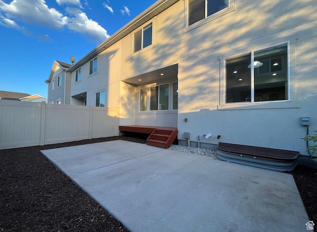 5558 W Dornton Ct, Herriman, UT 84096 - back of house featuring stucco siding and a patio area