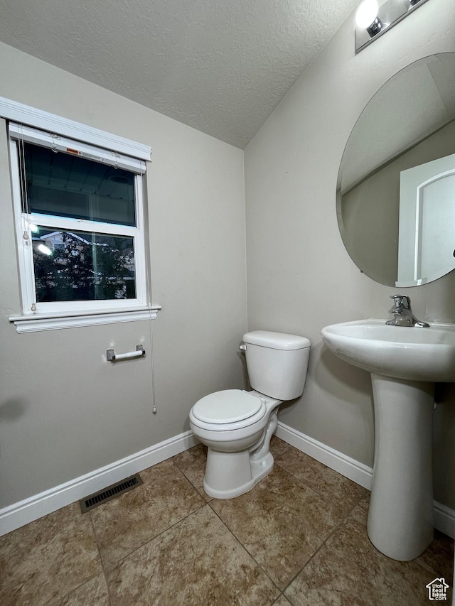 5558 W Dornton Ct, Herriman, UT 84096 - bathroom with a textured ceiling and tile patterned floors