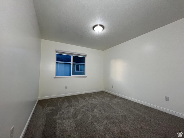 5558 W Dornton Ct, Herriman, UT 84096 - empty room featuring dark carpet and a textured ceiling