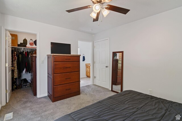 4139 N Mountain View Dr E, Eagle Mountain, UT 84005 - bedroom with light colored carpet, a walk in closet, a closet, and a ceiling fan