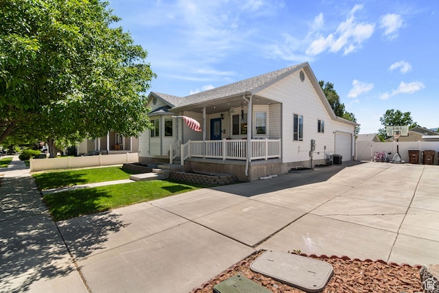 4139 N Mountain View Dr E, Eagle Mountain, UT 84005 - ranch-style house featuring covered porch, concrete driveway, a garage, and roof with shingles