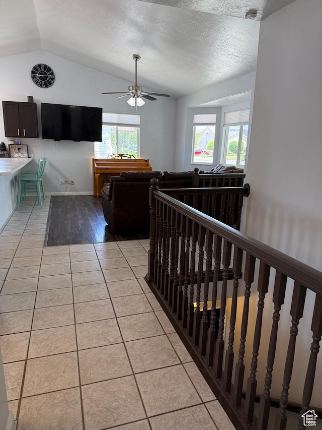 4139 N Mountain View Dr E, Eagle Mountain, UT 84005 - hallway featuring vaulted ceiling, light tile patterned floors, and an upstairs landing