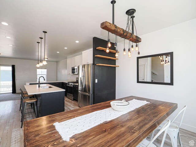 1051 W Narrows Ln S, Bluffdale, UT 84065 - dining space featuring light wood-style floors and recessed lighting