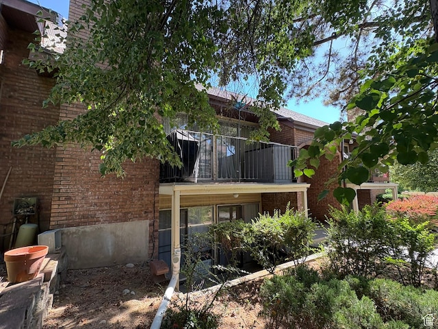 8158 S Cottonwood Hills Cir, Sandy, UT 84094 - back of property featuring brick siding and a balcony