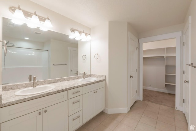 1611 N 3860 W, Lehi, UT 84043 - full bath featuring double vanity, a walk in shower, tile patterned floors, and a spacious closet