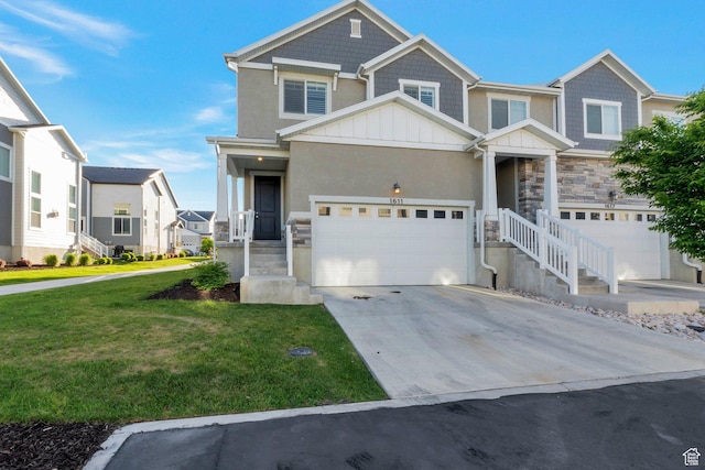 1611 N 3860 W, Lehi, UT 84043 - view of front of home featuring a front lawn, concrete driveway, stone siding, board and batten siding, and stucco siding