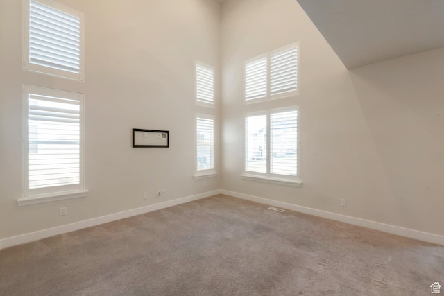 1611 N 3860 W, Lehi, UT 84043 - carpeted spare room featuring a high ceiling and baseboards