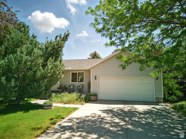 2265 Casperville Rd, Heber City, UT 84032 - view of front of house with driveway, a garage, a shingled roof, and a front lawn