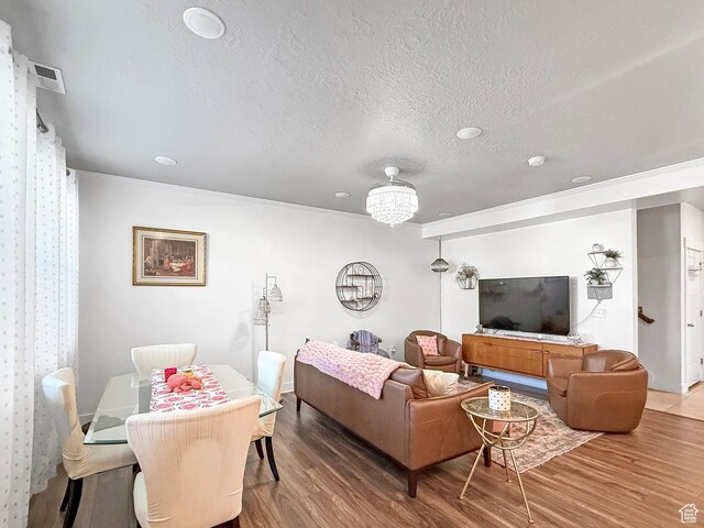4491 Haven Rd Unit 11E, West Haven, UT 84401 - living area with wood finished floors, crown molding, and a textured ceiling