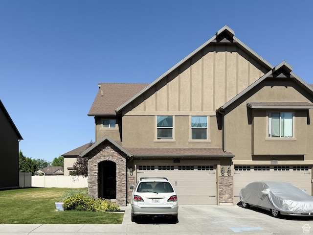 4491 Haven Rd Unit 11E, West Haven, UT 84401 - view of front of home featuring stone siding, a garage, board and batten siding, concrete driveway, and roof with shingles
