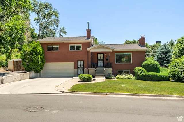 2922 E Hillsden Dr, Holladay, UT 84117 - split level home with a chimney, a garage, and brick siding