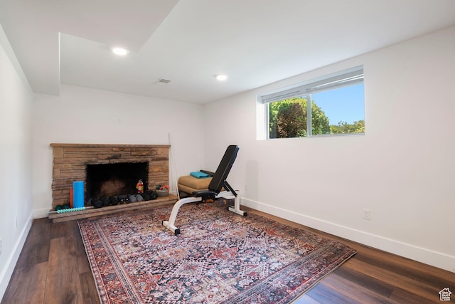 2922 E Hillsden Dr, Holladay, UT 84117 - sitting room with wood finished floors, a stone fireplace, and recessed lighting