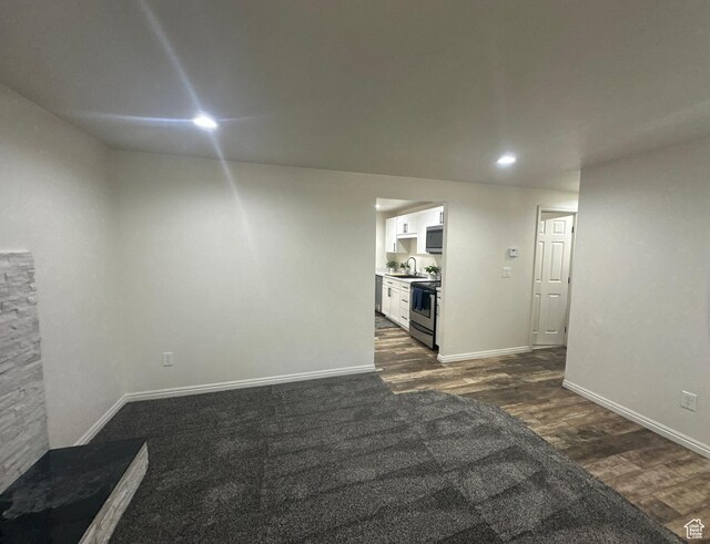 469 Canfield Dr, Ogden, UT 84404 - unfurnished living room featuring dark wood-style floors and recessed lighting