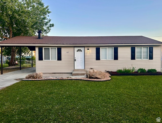 469 Canfield Dr, Ogden, UT 84404 - single story home featuring a carport, a front lawn, concrete driveway, and a shingled roof