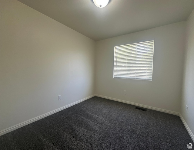 469 Canfield Dr, Ogden, UT 84404 - empty room with dark colored carpet