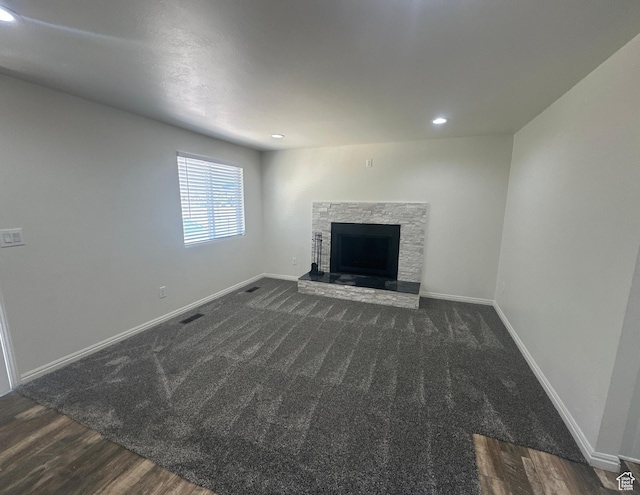 469 Canfield Dr, Ogden, UT 84404 - unfurnished living room featuring a fireplace, recessed lighting, wood finished floors, and carpet flooring