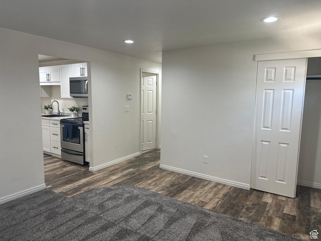 469 Canfield Dr, Ogden, UT 84404 - kitchen featuring appliances with stainless steel finishes, dark wood-style flooring, recessed lighting, and white cabinetry