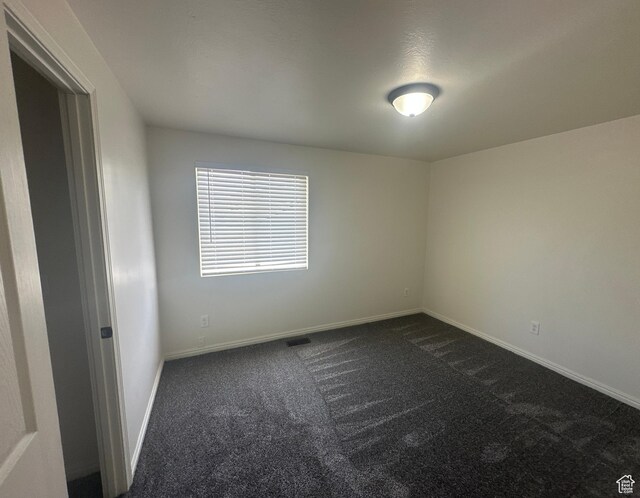 469 Canfield Dr, Ogden, UT 84404 - unfurnished room featuring dark carpet
