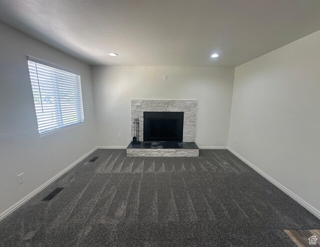 469 Canfield Dr, Ogden, UT 84404 - unfurnished living room featuring dark colored carpet, a fireplace, and recessed lighting