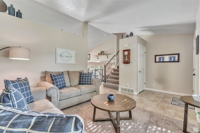 6925 S Sparrowtail Rd W, West Jordan, UT 84081 - living area with stairway, stone tile flooring, and vaulted ceiling