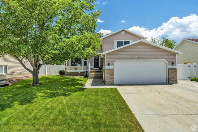 6925 S Sparrowtail Rd W, West Jordan, UT 84081 - view of front of property featuring a garage, brick siding, and driveway
