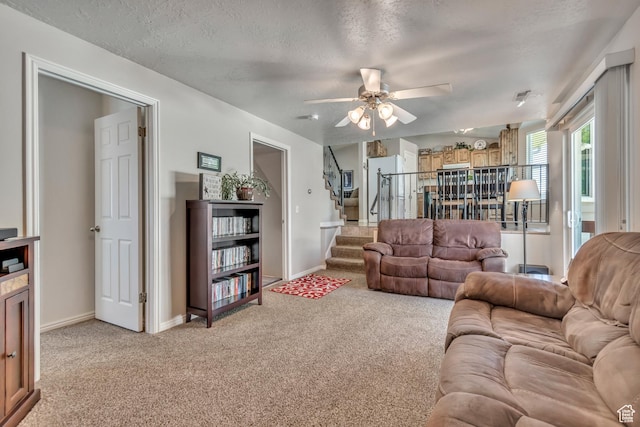 6925 S Sparrowtail Rd W, West Jordan, UT 84081 - living room featuring light colored carpet, ceiling fan, stairs, and a textured ceiling