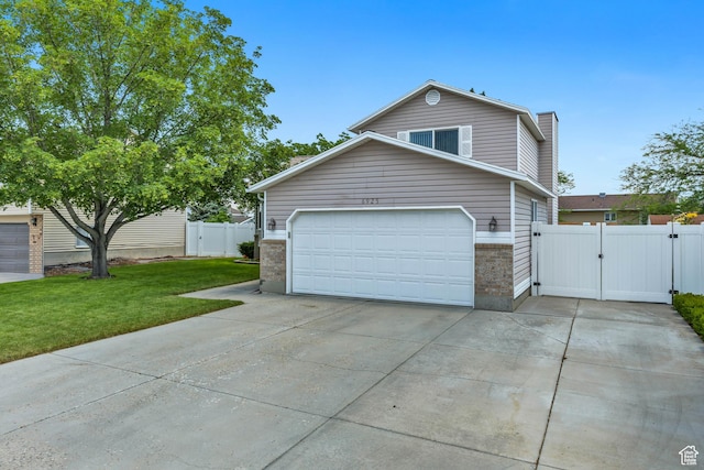 6925 S Sparrowtail Rd W, West Jordan, UT 84081 - view of front of property with a gate, driveway, a chimney, and brick siding