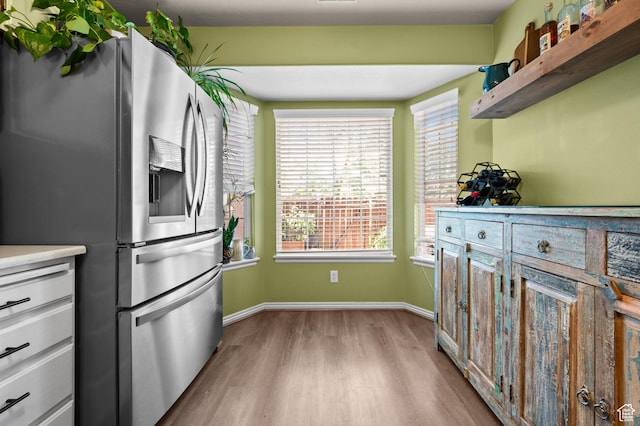176 S Geneva Dr, Midway, UT 84049 - kitchen with stainless steel fridge with ice dispenser, wood finished floors, light countertops, and plenty of natural light