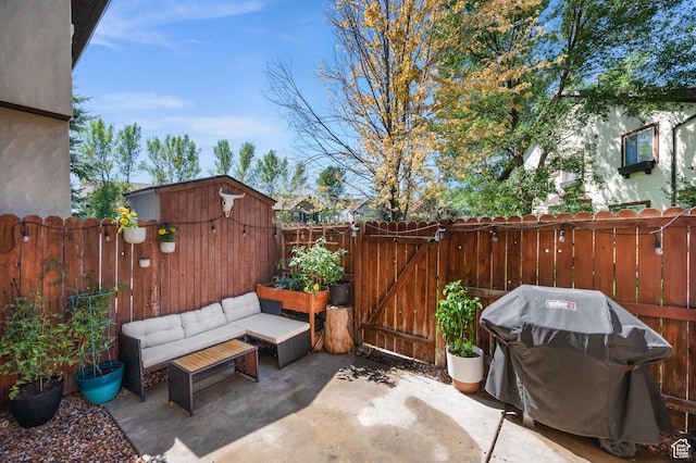 176 S Geneva Dr, Midway, UT 84049 - fenced backyard with a patio area, a grill, a gate, and an outdoor living space