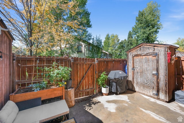 176 S Geneva Dr, Midway, UT 84049 - fenced backyard featuring area for grilling, a storage shed, a patio, a vegetable garden, and a gate