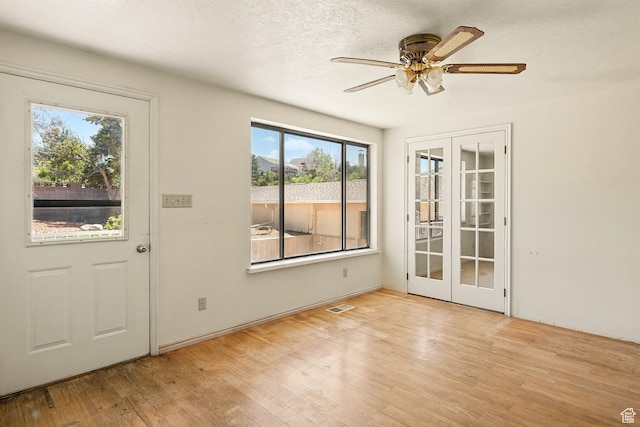 42 S Juniper Dr, Cedar City, UT 84720 - foyer with french doors, healthy amount of natural light, wood finished floors, and a ceiling fan