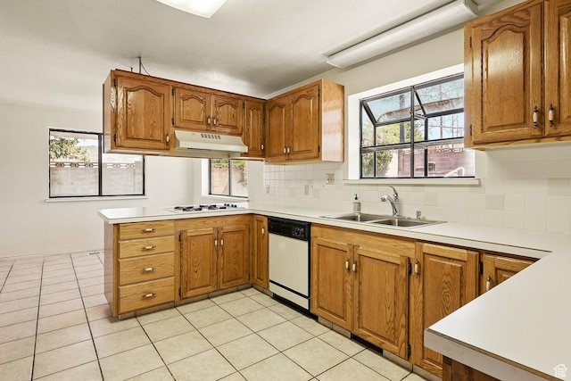 42 S Juniper Dr, Cedar City, UT 84720 - kitchen with white appliances, under cabinet range hood, light countertops, and brown cabinetry