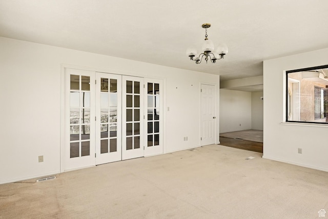42 S Juniper Dr, Cedar City, UT 84720 - carpeted empty room with a chandelier and baseboards