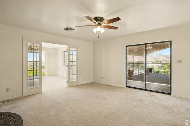 42 S Juniper Dr, Cedar City, UT 84720 - empty room featuring ceiling fan, healthy amount of natural light, and light colored carpet