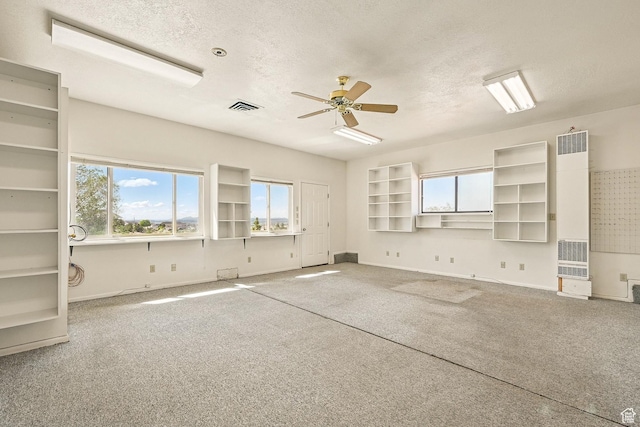 42 S Juniper Dr, Cedar City, UT 84720 - carpeted empty room with a heating unit, a textured ceiling, and ceiling fan