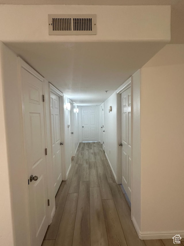 59 W Ridge Rd N, Saratoga Springs, UT 84043 - hallway featuring wood finished floors and baseboards