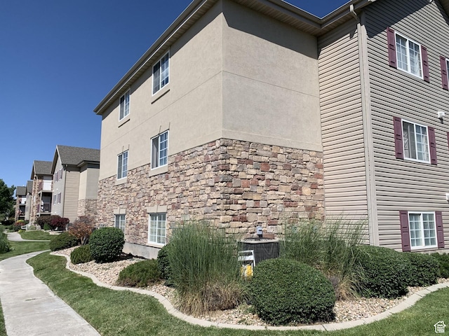 59 W Ridge Rd N, Saratoga Springs, UT 84043 - view of property exterior with stone siding and stucco siding