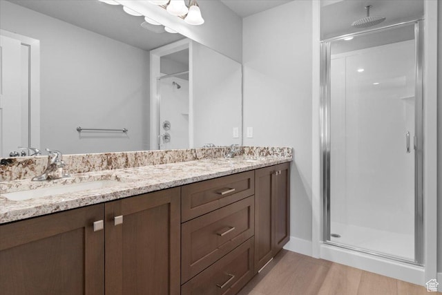 61 E 600 S, Nephi, UT 84648 - bathroom with a stall shower, double vanity, and wood finished floors