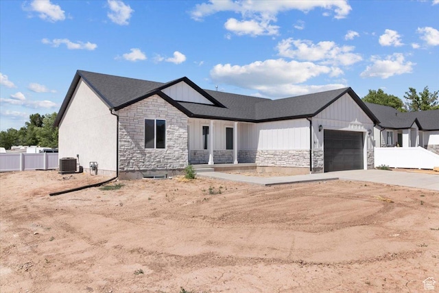 61 E 600 S, Nephi, UT 84648 - modern farmhouse style home with stone siding, a garage, concrete driveway, and a shingled roof