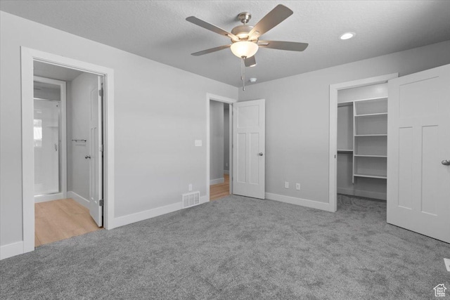 61 E 600 S, Nephi, UT 84648 - unfurnished bedroom featuring carpet, a spacious closet, ensuite bathroom, a closet, and ceiling fan