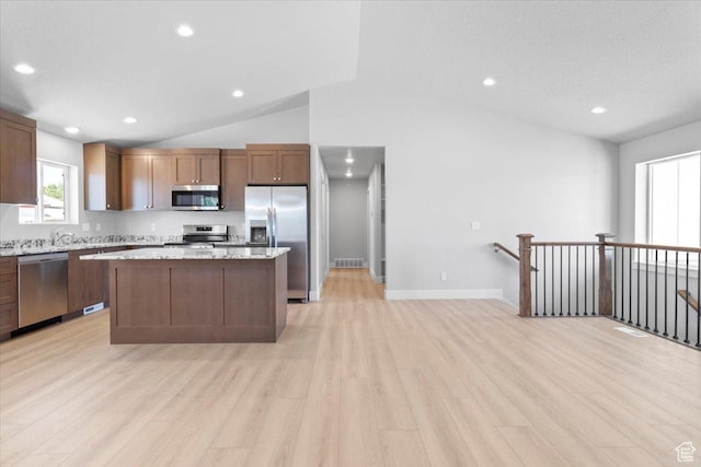 61 E 600 S, Nephi, UT 84648 - kitchen featuring appliances with stainless steel finishes, lofted ceiling, light wood-type flooring, a center island, and recessed lighting