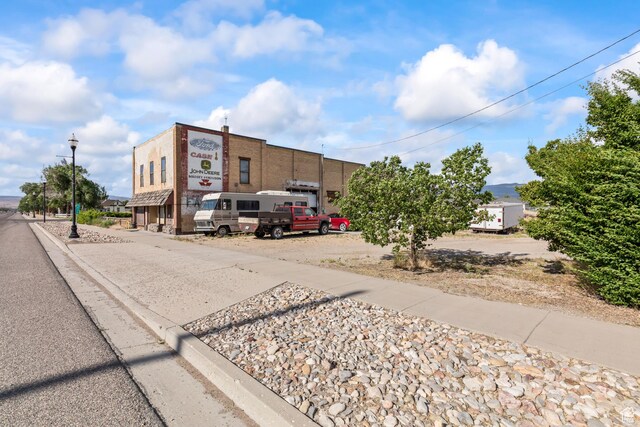 125 S Main St, Centerfield, UT 84622 - view of asphalt street featuring street lights, sidewalks, and curbs