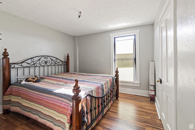 125 S Main St, Centerfield, UT 84622 - bedroom featuring wood finished floors and a textured ceiling