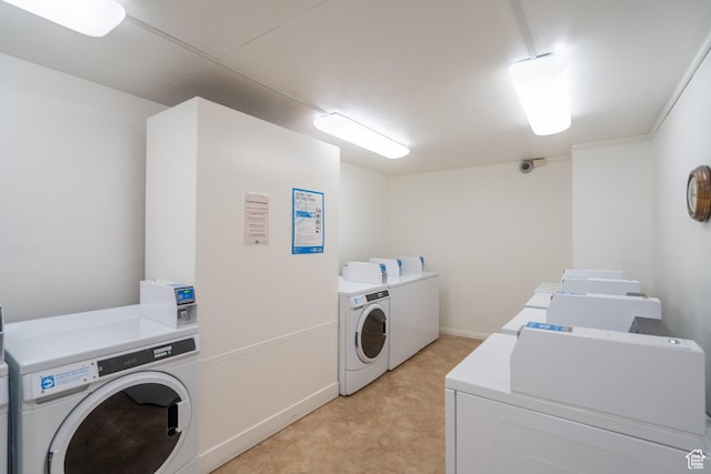 777 E S Temple N Unit 4B, Salt Lake City, UT 84102 - communal laundry room featuring separate washer and dryer and baseboards