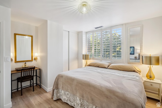 777 E S Temple N Unit 4B, Salt Lake City, UT 84102 - bedroom featuring wood finished floors and a closet