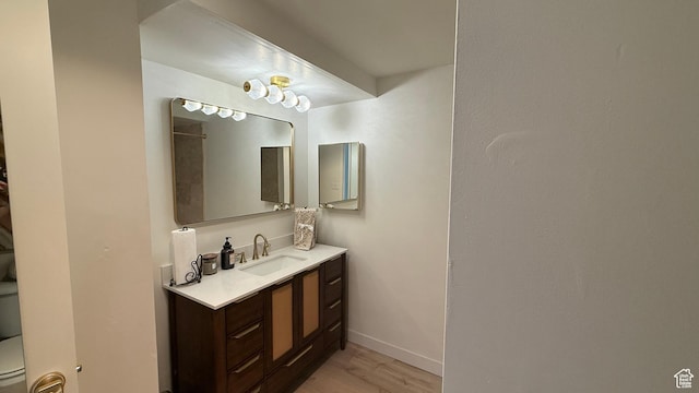 777 E S Temple N Unit 4B, Salt Lake City, UT 84102 - bathroom with wood finished floors and vanity