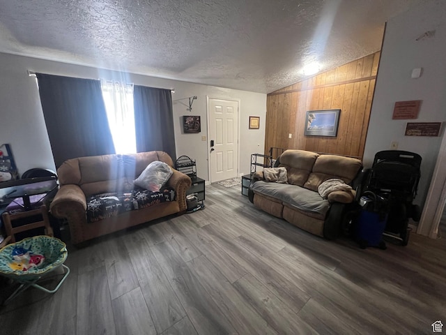 675 W 2550 S, Price, UT 84501 - living room featuring a textured ceiling, vaulted ceiling, wood finished floors, and wood walls