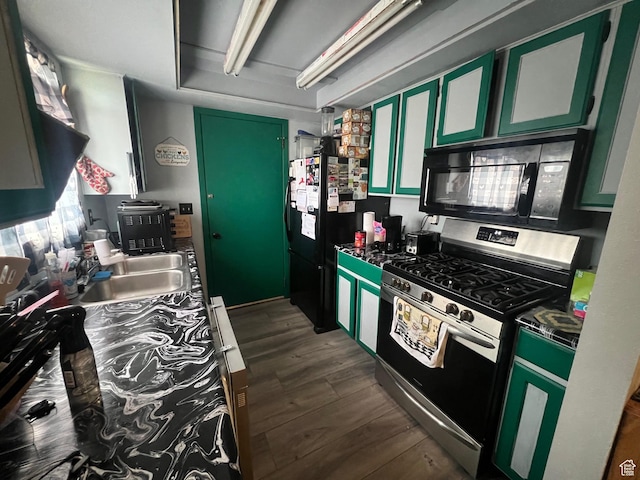 675 W 2550 S, Price, UT 84501 - kitchen featuring black appliances, dark wood finished floors, dark countertops, and green cabinets