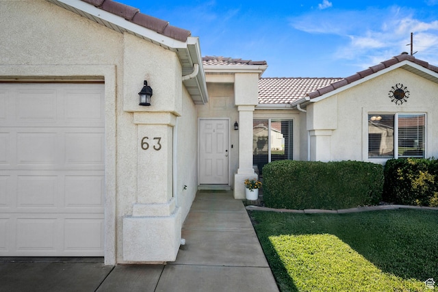 470 E 1100 S Unit 63, St George, UT 84790 - entrance to property with an attached garage, a tiled roof, and stucco siding