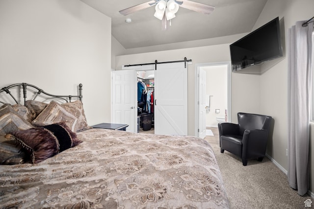 470 E 1100 S Unit 63, St George, UT 84790 - bedroom featuring vaulted ceiling, carpet flooring, a spacious closet, a barn door, and ensuite bathroom